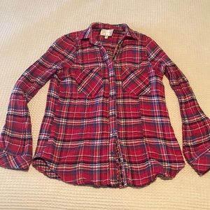 Skies are blue red, blue, white plaid top